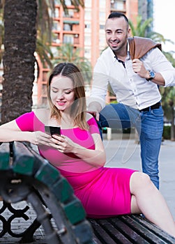 Young woman is inaccessibility when man is playful talking with her