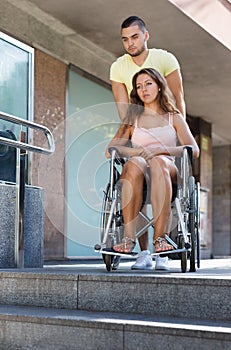 Young woman on invalid chair