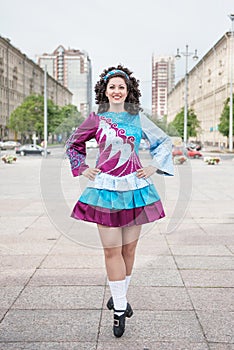 Young woman in irish dance dress posing