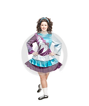 Young woman in irish dance dress posing isolated