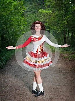 Young woman in irish dance dress and wig welcoming