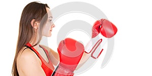 Young woman isolated on white background wearing red boxing gloves working out with box aerobics cardio