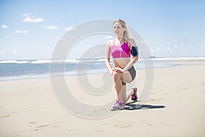 Young woman jogging on the beach in summer day. Athlete runner exercising actively in sunny day