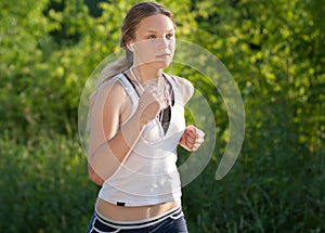 Young woman is jogging in the park