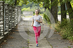 Young woman Jogging in the Park. Morning jog. Healthy lifestyle.