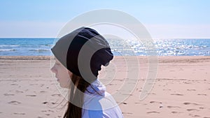 Young woman is jogging on sea sand beach portrait jogger run sport fit outdoors