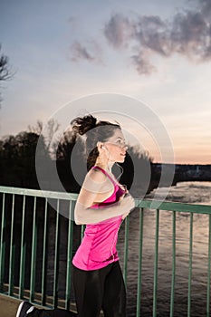 Young woman jogging at sunset