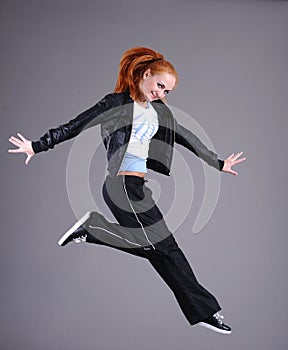 Young woman jumping and dancing