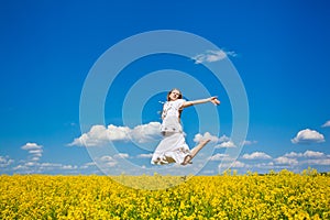 Young woman jumping on field