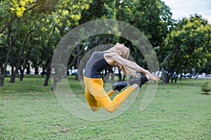 young woman jumping in the park