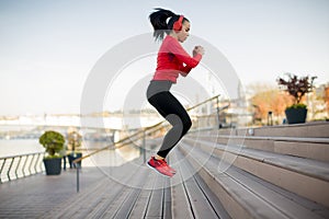 Young woman jumping outdoor