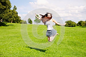 Young woman jumping outdoor