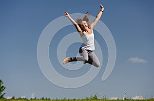 Young woman jumping outside