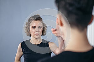 Young woman karate student with her trainer in gym. Taekwondo coach teaching adult woman in personal training. Two women