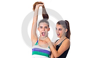 Young woman keeping another woman's throat