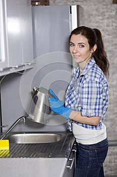 Young woman with a kettle