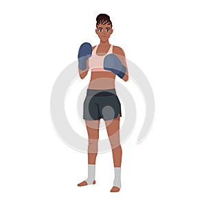 Young woman kick boxer standing and posing