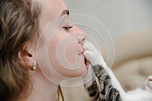 Young woman kisses a cat.Girl with cat