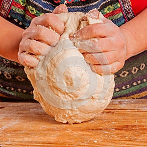 Young woman kneading dough. Food, Ñooking process, sweets concept