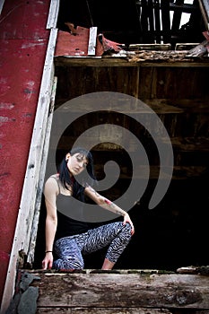 Young Woman Kneeling in Doorway