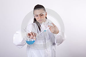 Young woman lab technician holding a test tube
