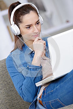 young woman laptop and headset