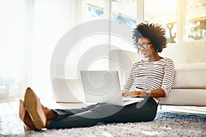 Young woman, laptop and living room floor relax doing online shopping sitting on ground. Home, happiness and computer