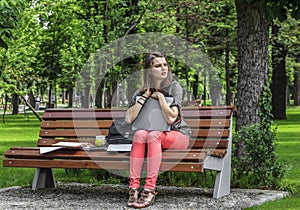 Young Woman with a Laptop in the Park