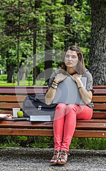 Young Woman with a Laptop in the Park