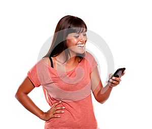 Young woman laughing while reading a message