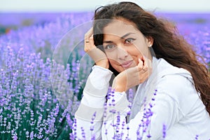 Young woman is in the lavender flower field, beautiful summer landscape