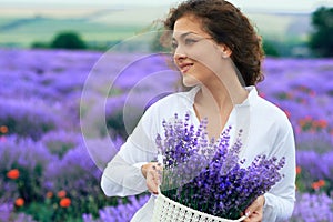 Young woman is in the lavender flower field, beautiful summer landscape