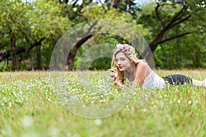 Young woman laying down on the grass