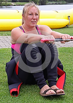 Young woman learning to water ski