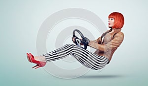 Young woman in a leather jacket and gloves driver car with a wheel, auto concept