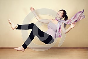 Young woman levitating