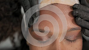 A young woman lies on procedures at the beautician, Skin care, cleansing and moisturizer, spa concept. Close up concept