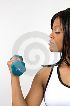 Young Woman Lifting Dumbbell