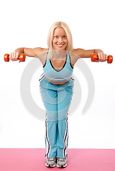 Young woman lifting weights