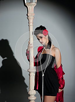 Young woman and lightpole