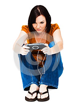 Young woman listening media player