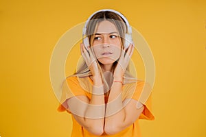 Young woman listening music with headphones.