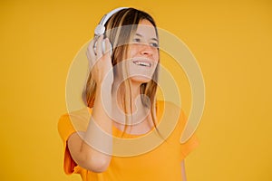 Young woman listening music with headphones.