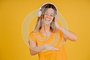 Young woman listening music with headphones.