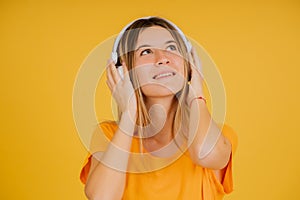 Young woman listening music with headphones.