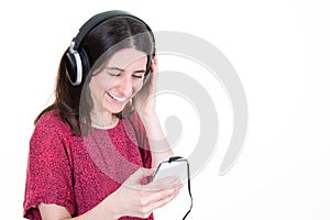 Young woman listening music using mobile phone aside copy space white background