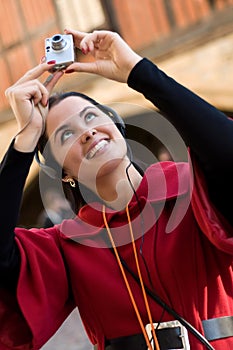 Young woman listening to audio guide