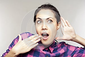 Young woman listening to gossip