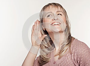 Young woman listening to gossip