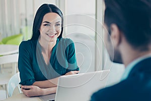 Young woman listening to her future colleague about new job in f